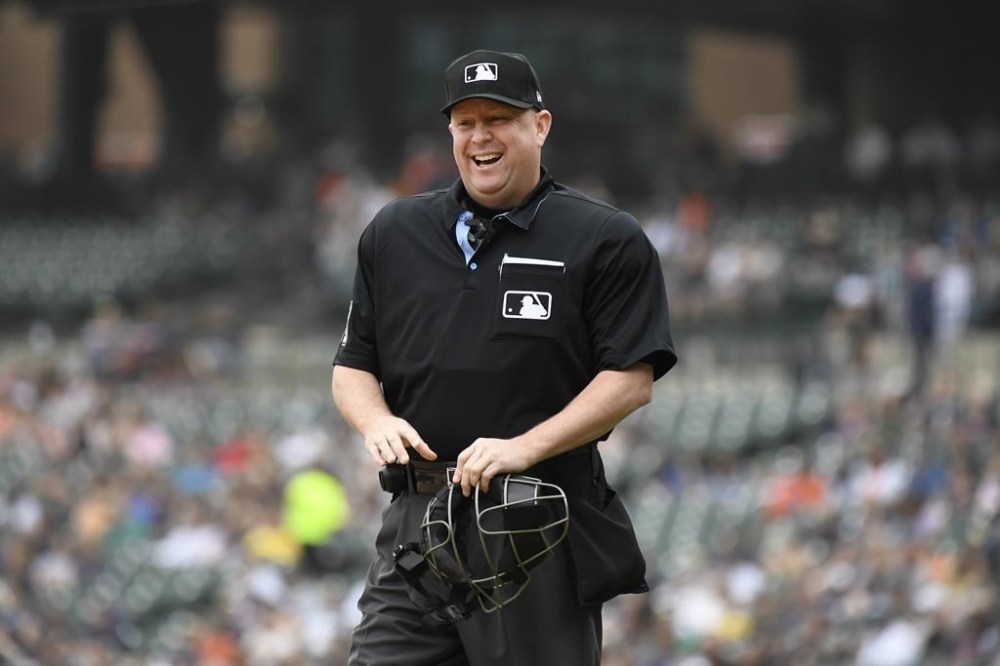 FILE - Home plate umpire Todd Tichenor laughs before a baseball game against the Detroit Tigers, Saturday, May 13, 2023, in Detroit. Tichenor will be the home plate umpire and crew chief for the All-Star Game at Seattle’s T-Mobile Park on July 11. (AP Photo/Jose Juarez, File)