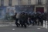 FILE - Riot police officers charge youths after a demonstration Tuesday, March 28, 2023 in Paris. (AP Photo/Thibault Camus, File)