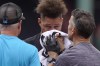 Miami Marlins' Yuli Gurriel, center, is assisted after being hit in the face by a baseball before a baseball game against the Boston Red Sox, Thursday, June 29, 2023, in Boston. (AP Photo/Steven Senne)