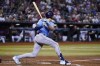 Tampa Bay Rays' Josh Lowe watches the flight of his run-scoring single against the Arizona Diamondbacks during the third inning of a baseball game Thursday, June 29, 2023, in Phoenix. (AP Photo/Ross D. Franklin)
