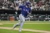 Texas Rangers' Corey Seager runs after hitting a two-run double against the Chicago White Sox during the eighth inning of a baseball game in Chicago, Tuesday, June 20, 2023. (AP Photo/Nam Y. Huh)
