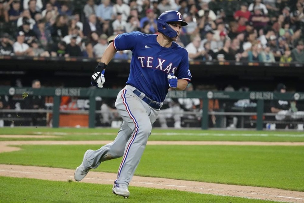 Texas Rangers' Corey Seager runs after hitting a two-run double against the Chicago White Sox during the eighth inning of a baseball game in Chicago, Tuesday, June 20, 2023. (AP Photo/Nam Y. Huh)