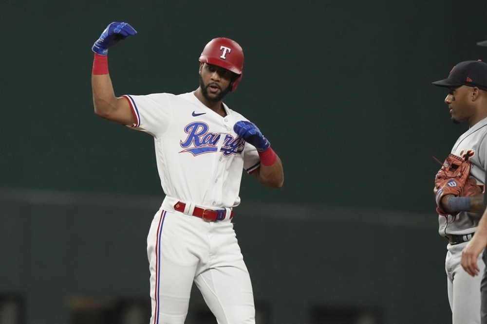 Texas Rangers Leody Taveras reacts after driving in teammate Josh Jung to score during the sixth inning of a baseball game against the Detroit Tigers in Arlington, Texas, Tuesday, June 27, 2023. (AP Photo/LM Otero)