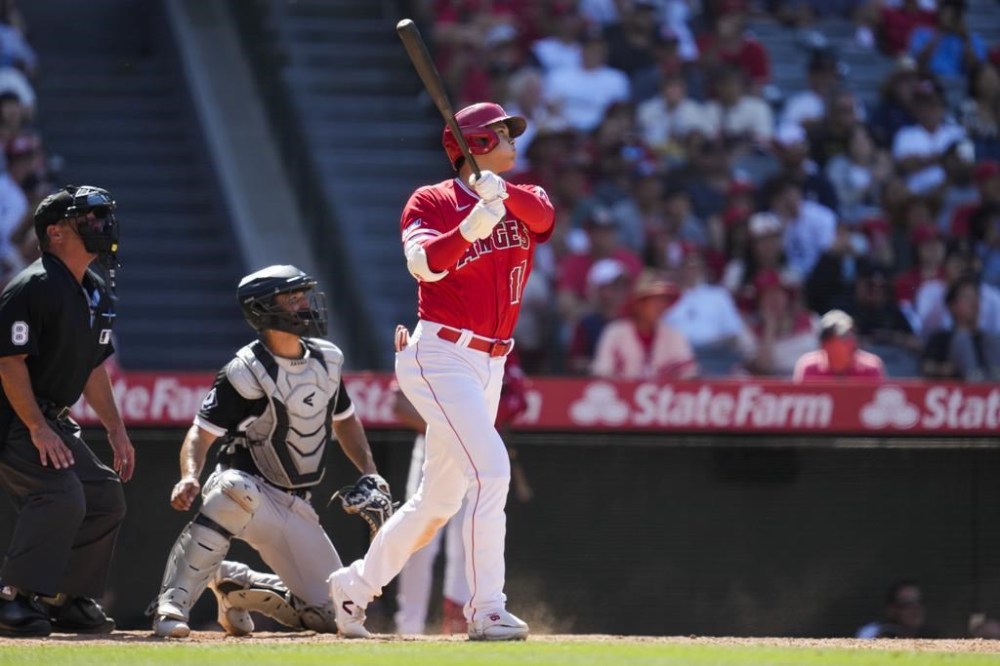Los Angeles Angels designated hitter Shohei Ohtani (17) hits a home run during the ninth inning of a baseball game against the Chicago White Sox in Anaheim, Calif., Thursday, June 29, 2023. Mike Trout also scored. (AP Photo/Ashley Landis)