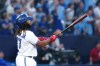 Toronto Blue Jays designated hitter Vladimir Guerrero Jr. (27) hits a two-run home run against the San Francisco Giants during sixth inning MLB Interleague baseball action in Toronto on Thursday, June 29, 2023. THE CANADIAN PRESS/Chris Young