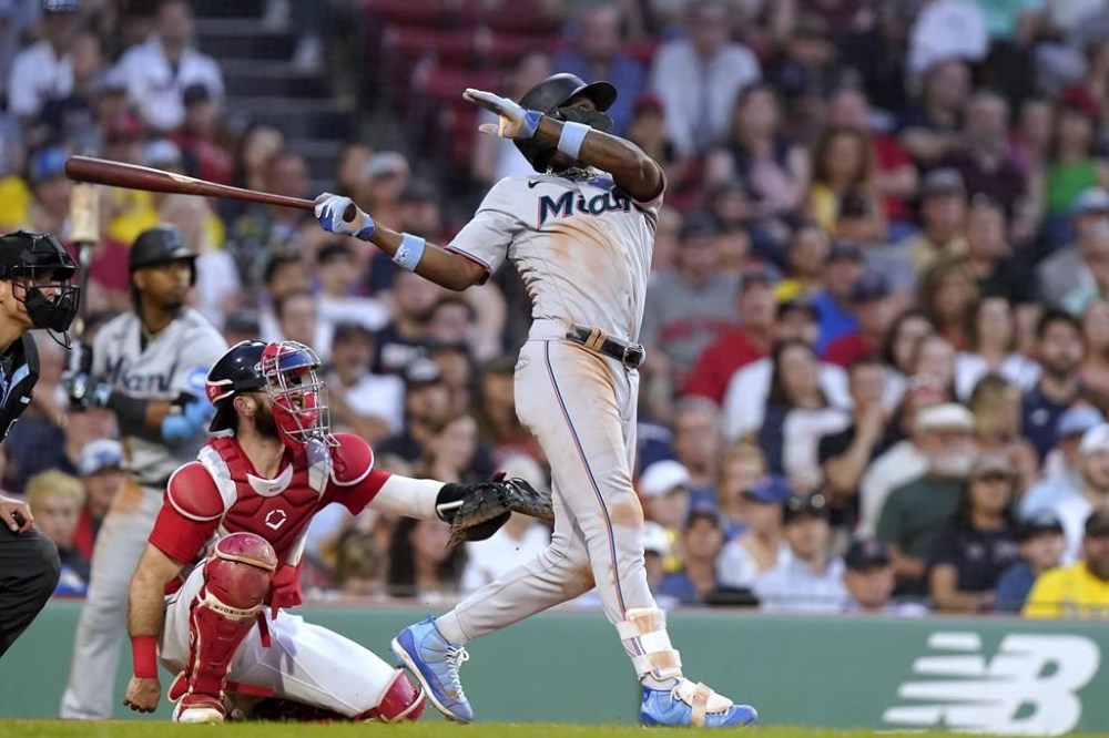 Miami Marlins' Jazz Chisholm Jr., right, watches his home run next to Boston Red Sox's Connor Wong during the ninth inning of a baseball game Thursday, June 29, 2023, in Boston. (AP Photo/Steven Senne)