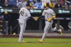 Milwaukee Brewers' Victor Caratini (7) celebrates with third base coach Jason Lane (40) as he runs the bases on a two-run home run against the New York Mets during the sixth inning of a baseball game Thursday, June 29, 2023, in New York. (AP Photo/Frank Franklin II)
