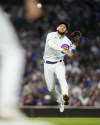 Chicago Cubs third baseman Nick Madrigal throws out Philadelphia Phillies' Bryce Harper at first during the sixth inning of a baseball game Thursday, June 29, 2023, in Chicago. (AP Photo/Charles Rex Arbogast)