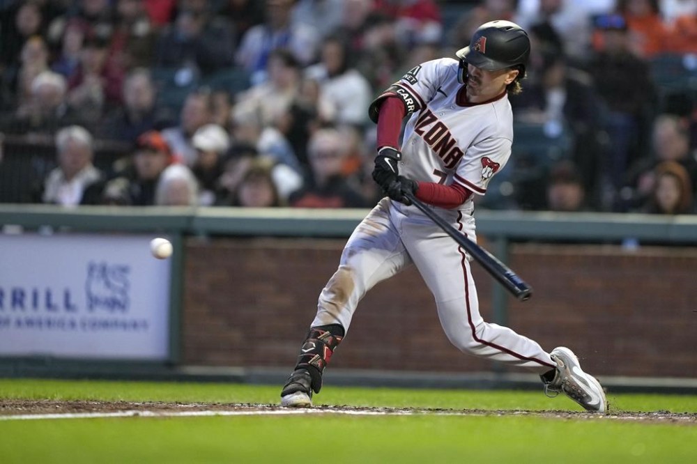 Arizona Diamondbacks' Corbin Carroll hits a single for a RBI against the San Francisco Giants during the fifth inning of a baseball game in San Francisco, Friday, June 23, 2023. (AP Photo/Tony Avelar)