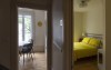 A small meeting room and bedroom are seen in a new boarding house for women experiencing homelessness or in vulnerable positions in Montreal, Tuesday, June 27, 2023. Rooming or boarding houses are regaining favour with some Canadian cities as a way to offset a lack of affordable homes, but experts warn that there are pitfalls to turning to a form of housing that some see as problematic. THE CANADIAN PRESS/Christinne Muschi