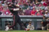 Cincinnati Reds' Jonathan India singles against the San Diego Padres during the fourth inning of a baseball game in Cincinnati, Friday, June 30, 2023. (AP Photo/Aaron Doster)
