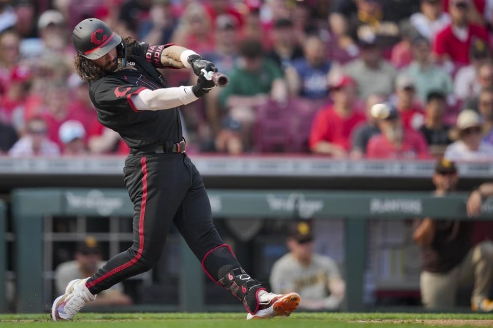 Cincinnati Reds' Jonathan India singles against the San Diego Padres during the fourth inning of a baseball game in Cincinnati, Friday, June 30, 2023. (AP Photo/Aaron Doster)