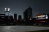 The skies darken and tarp covers the field as rain threatens the scheduled start of a baseball game between the St. Louis Cardinals and the New York Yankees Friday, June 30, 2023, in St. Louis. (AP Photo/Jeff Roberson)