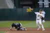 Oakland Athletics shortstop Aledmys Díaz, right, throws to first base after forcing out Chicago White Sox' Zach Remillard, left, at second base during the fourth inning of a baseball game in Oakland, Calif., Friday, June 30, 2023. Andrew Benintendi reached first on the play. (AP Photo/Godofredo A. Vásquez)