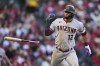 Arizona Diamondbacks designated hitter Lourdes Gurriel Jr. (12) flips his bat after hitting a grand slam during the second inning of a baseball game against the Los Angeles Angels in Anaheim, Calif., Friday, June 30, 2023. Jake McCarthy, Geraldo Perdomo, and Ketel Marte also scored. (AP Photo/Ashley Landis)