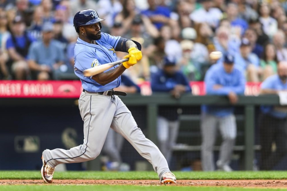 Tampa Bay Rays' Randy Arozarena hits a two-run home run against the Seattle Mariners during the fourth inning of a baseball game, Friday, June 30, 2023, in Seattle. (AP Photo/Caean Couto)