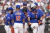 New York Mets starting pitcher Justin Verlander, center, meets on the mound with his teammates in the seventh inning of a baseball game against the San Francisco Giants, Saturday, July 1, 2023, in New York. (AP Photo/John Minchillo)
