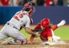 Boston Red Sox catcher Connor Wong (12) tags out Toronto Blue Jays' Bo Bichette for the final out of 9th inning MLB action Toronto on Saturday, July 1, 2023. THE CANADIAN PRESS/Frank Gunn