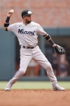 Miami Marlins second baseman Luis Arraez (3) throws to first forcing out Atlanta Braves designated hitter Marcell Ozuna (20) in the third inning during a baseball game Saturday, July 1, 2023, in Atlanta. (AP Photo/Alex Slitz)