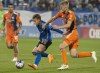 CF Montreal's Bryce Duke, centre, tries to keep the ball away from New York City FC's Keaton Parks during first half MLS action in Montreal, Saturday, July 1, 2023. THE CANADIAN PRESS/Peter McCabe