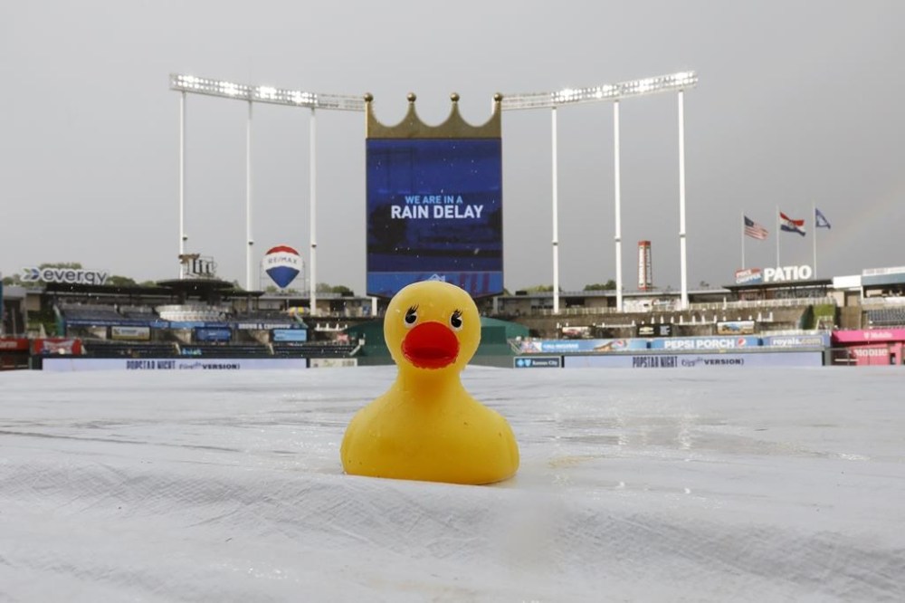 A tarp covers the field during a rain delay before a baseball game between the Kansas City Royals the Los Angeles Dodgers in Kansas City, Mo., Saturday, July 1, 2023. (AP Photo/Colin E. Braley)
