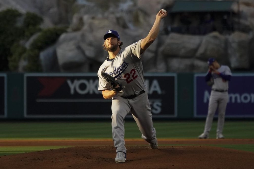 Los Angeles Dodgers starting pitcher Clayton Kershaw (22) throws during the first inning of a baseball game against the Los Angeles Angels in Anaheim, Calif., Tuesday, June 20, 2023. (AP Photo/Ashley Landis)