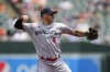 Minnesota Twins shortstop Carlos Correa throws to first base while fielding a ground out from the Baltimore Orioles in the third inning of a baseball game, Sunday, July 2, 2023, in Baltimore. (AP Photo/Julio Cortez)