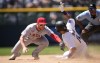 Los Angeles Angels second baseman Brandon Drury, left, tags out Colorado Rockies' Ezequiel Tovar as he tries to steal second base in the seventh inning of a baseball game, Sunday, June 25, 2023, in Denver. (AP Photo/David Zalubowski)
