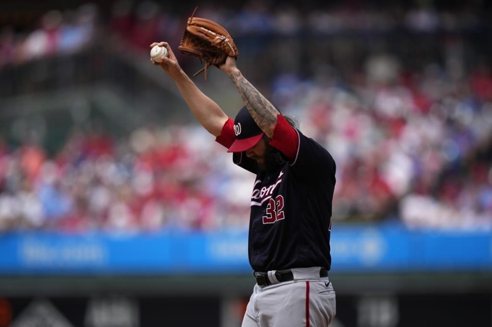 Washington Nationals pitcher Trevor Williams stretches during the third inning of a baseball game against the Philadelphia Phillies, Sunday, July 2, 2023, in Philadelphia. (AP Photo/Matt Slocum)