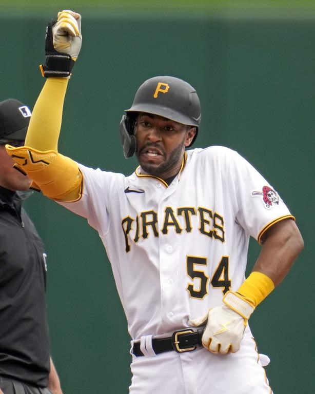 Pittsburgh Pirates' Josh Palacios celebrates as he stands on second base after hitting a double off Milwaukee Brewers starting pitcher Colin Rea during the second inning of a baseball game in Pittsburgh, Sunday, July 2, 2023. (AP Photo/Gene J. Puskar)
