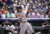 Detroit Tigers' Jake Marisnick follows through with his swing after connecting for a grand slam off Colorado Rockies relief pitcher Brad Hand in the eighth inning of a baseball game Sunday, July 2, 2023, in Denver. (AP Photo/David Zalubowski)