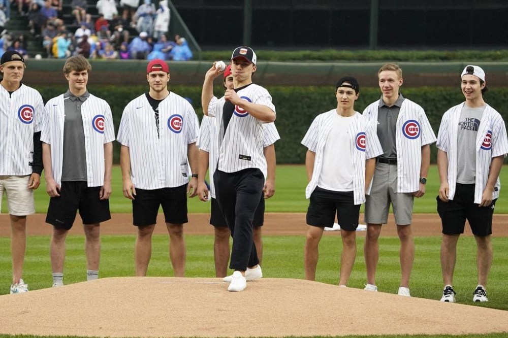 Chicago Blackhawks' No. 1 overall pick in the NHL draft Connor Bedard throws out a ceremonial first pitch before a baseball game between the Chicago Cubs and the Cleveland Guardians, Sunday, July 2, 2023, in Chicago. (AP Photo/David Banks)