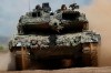 FILE - A Germany army Main battle tank Leopard 2A6 takes part in the Lithuanian-German military exercise 'Griffin Storm 2023' at a training range in Pabrade, some 60km (38 miles) north of the capital Vilnius, Lithuania on Monday, June 26, 2023. Russia’s armed forces are bruised but by no means beaten in the war in Ukraine, a top NATO military officer said Monday, as he laid out the biggest revamp to the organization’s military plans since the Cold War should Moscow dare to widen the conflict. (AP Photo/Mindaugas Kulbis, File)