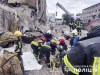 In this photo provided by the National Police of Ukraine, emergency services work near to the RIA Pizza restaurant destroyed by a Russian attack in Kramatorsk, Ukraine, Wednesday, June 28, 2023. (National Police of Ukraine via AP)