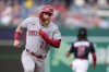 Cincinnati Reds' Jake Fraley advances to third base on Spencer Steer's single in the second inning of a baseball game against the Washington Nationals, Monday, July 3, 2023, in Washington. (AP Photo/Patrick Semansky)