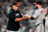 Baltimore Orioles manager Brandon Hyde, left, takes the ball from relief pitcher Danny Coulombe during the eighth inning of a baseball game against the New York Yankees, Monday, July 3, 2023, in New York. (AP Photo/Frank Franklin II)