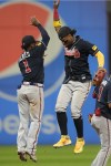 Atlanta Braves' Ozzie Albies (1) and Ronald Acuna Jr., right, celebrate after they defeated the Cleveland Guardians in a baseball game Monday, July 3, 2023, in Cleveland. (AP Photo/Sue Ogrocki)