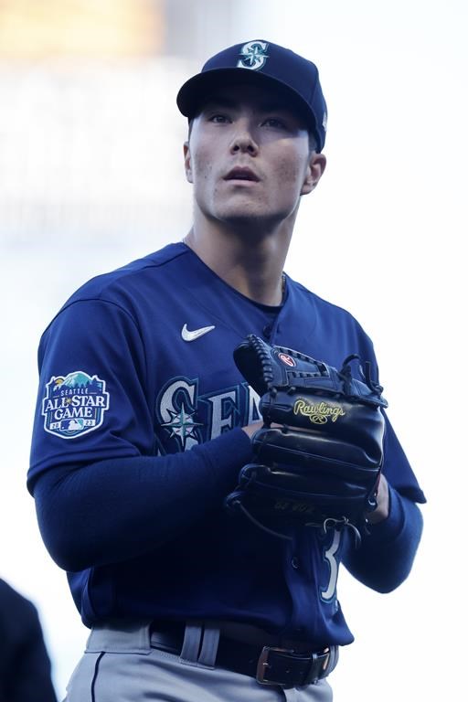 Seattle Mariners starter Bryan Woo walks back to dugout after pitching in the first inning of a baseball game against the San Francisco Giants in San Francisco, Monday, July 3, 2023. (AP Photo/Josie Lepe)