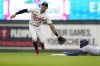 Kansas City Royals' Bobby Witt Jr., right, beats a throw to Minnesota Twins shortstop Carlos Correa, left, to steal second base during the third inning of a baseball game Monday, July 3, 2023, in Minneapolis. (AP Photo/Abbie Parr)