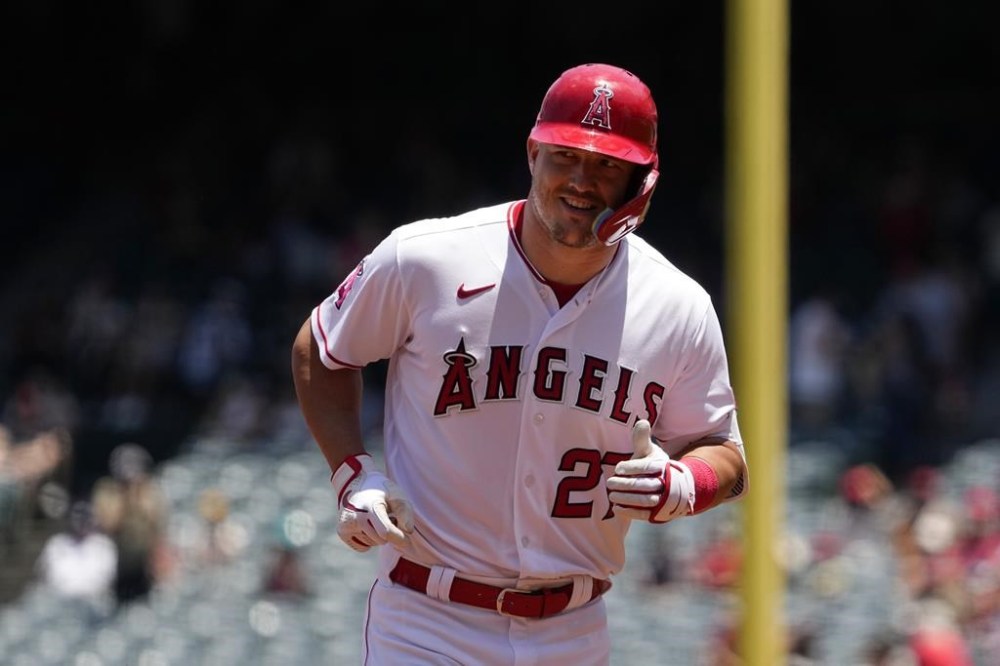 Los Angeles Angels' Mike Trout smiles as he rounds third after hitting a solo home run during the first inning of a baseball game against the Arizona Diamondbacks Sunday, July 2, 2023, in Anaheim, Calif. (AP Photo/Mark J. Terrill)