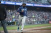 Seattle Mariners' Teoscar Hernandez scores on a wild pitch in the fourth inning of a baseball game against the San Francisco Giants in San Francisco, Monday, July 3, 2023. (AP Photo/Josie Lepe)