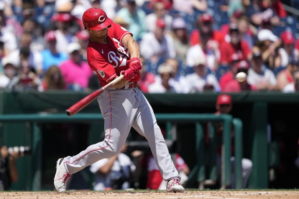 Cincinnati Reds' Nick Senzel hits a three-run home run in the third inning of a baseball game against the Washington Nationals, Tuesday, July 4, 2023, in Washington. (AP Photo/Patrick Semansky)