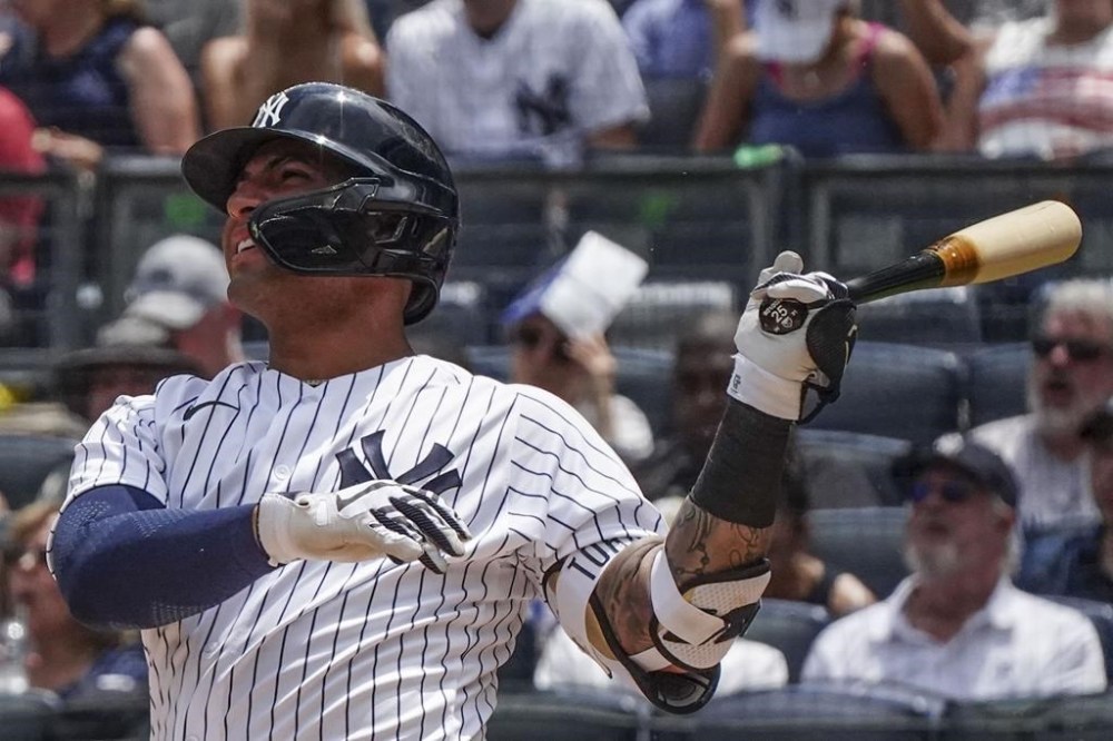 New York Yankees' Gleyber Torres watches his two run homer in the first inning of a baseball game against the Baltimore Orioles, Tuesday, July 4, 2023, in New York. (AP Photo/Bebeto Matthews)