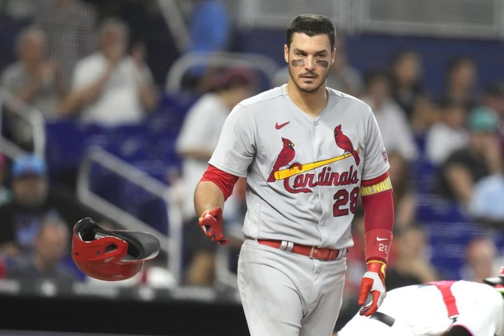 St. Louis Cardinals' Nolan Arenado (28) tosses his helmet after he struck out swinging during the fifth inning of a baseball game against the Miami Marlins, Tuesday, July 4, 2023, in Miami. (AP Photo/Lynne Sladky)