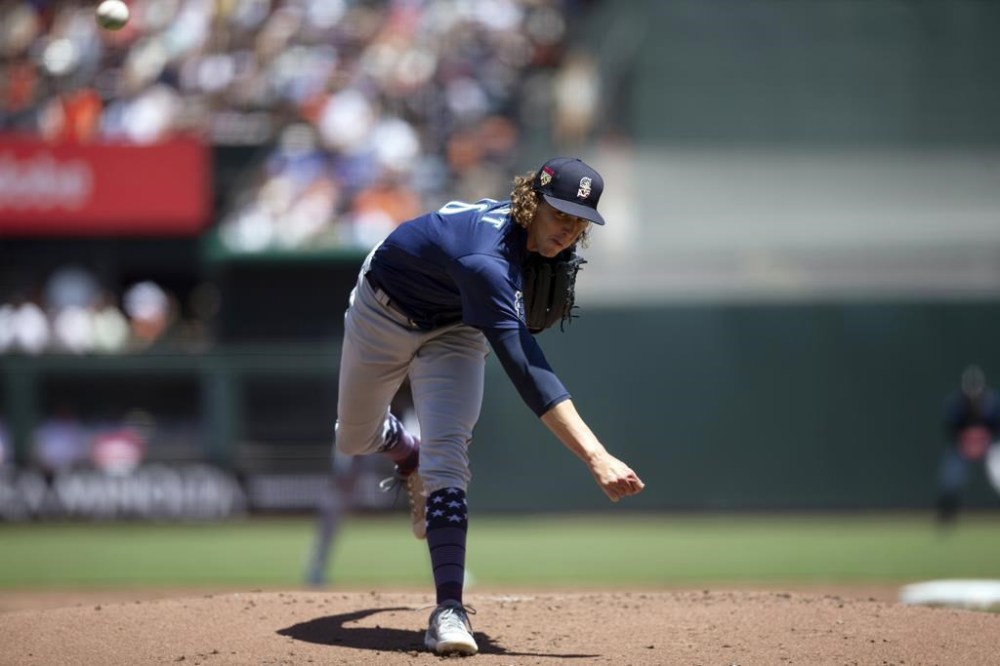 Seattle Mariners starting pitcher Logan Gilbert watches a throw to a San Francisco Giants batter during the first inning of a baseball game Tuesday, July 4, 2023, in San Francisco. (AP Photo/D. Ross Cameron)