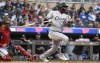 FILE - Chicago White Sox' Oscar Colas follows through after making contact, during the first inning of the team's baseball game against the Minnesota Twins on April 11, 2023, in Minneapolis. The White Sox recalled Colás from Triple-A Charlotte on Tuesday, July 4, confident the Cuban outfielder will perform better than he did at the start of the season. (AP Photo/Craig Lassig, File)