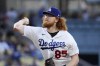 FILE - Los Angeles Dodgers starting pitcher Dustin May throws to a San Diego Padres batter during the first inning of baseball game May 12, 2023, in Los Angeles. May will undergo season-ending elbow surgery later this month, the latest blow to a rotation that has been hard-hit by injury. The 25-year-old right-hander will have surgery to repair the flexon tendon in his right elbow on July 18, the team said Tuesday, July 4. (AP Photo/Mark J. Terrill, File)