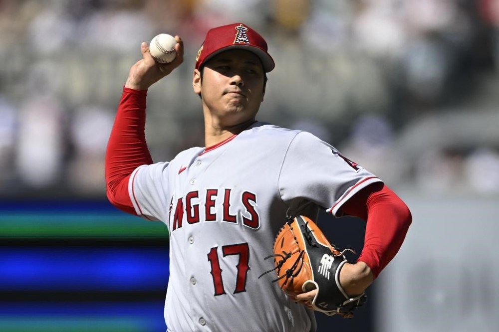 Los Angeles Angels starting pitcher Shohei Ohtani (17) delivers during the first inning of the team's baseball game against the San Diego Padres on Tuesday, July 4, 2023, in San Diego. (AP Photo/Denis Poroy)