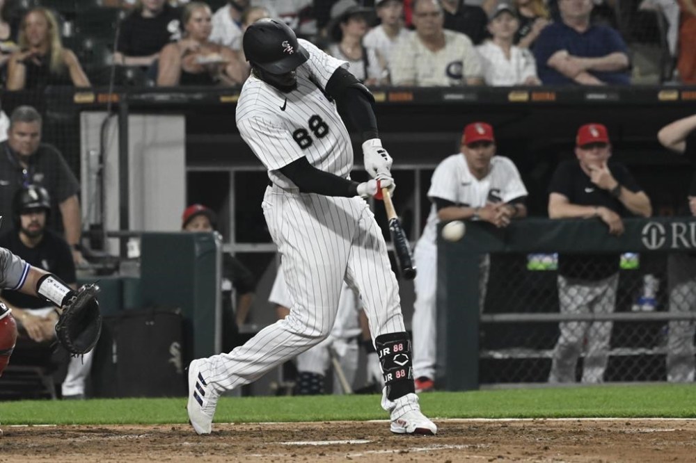 Chicago White Sox's Luis Robert Jr. hits a three-run home run against the Toronto Blue Jays during the sixth inning of a baseball game Tuesday, July 4, 2023, in Chicago. (AP Photo/Matt Marton)