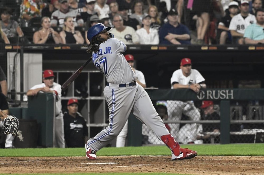 Toronto Blue Jays' Vladimir Guerrero Jr. watches his two-run home run against the Chicago White Sox during the eighth inning of a baseball game Tuesday, July 4, 2023, in Chicago. (AP Photo/Matt Marton)